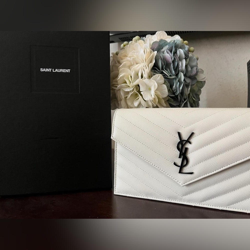 YSL wallet on a chain in white and black